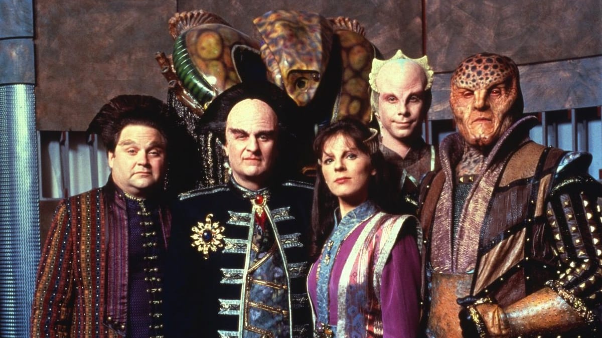 A photo of the "alien" cast members of Babylon 5, posing for the shot.